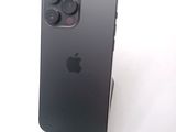 an apple iphone is sitting on top of a stand on a white surface