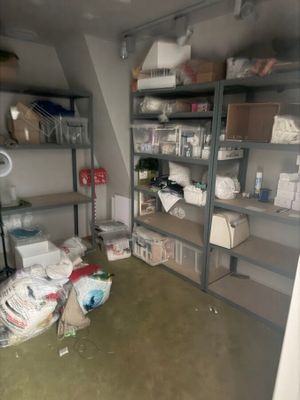 a room that has a lot of boxes and boxes on the shelves