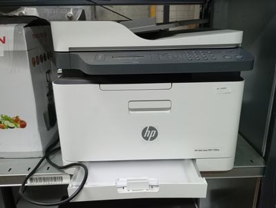 a printer that is sitting on top of a shelf