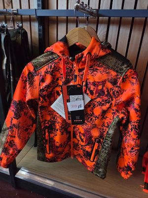 an orange and black jacket on display in a clothing store