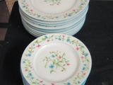 a lot of plates that are sitting on a table
