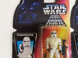 two star wars action figures on display on the table