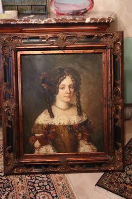 a painting of a woman in a brown dress sitting on the floor