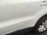 a white car parked on the side of the road