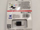 a close up of a package of electronic devices on a white surface