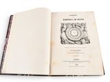 an open book with a picture of a clock on it
