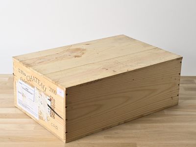 a wooden box that is sitting on a wooden floor