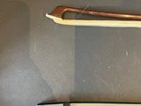 two different types of violin bows on the table