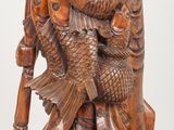 an image of a statue of a man with a fish on his back