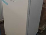 a white refrigerator with a blue stripe on the door