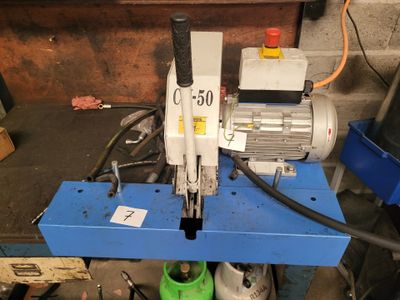 a machine that is sitting on top of a blue table