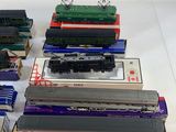 a lot of different model trains sitting on a table