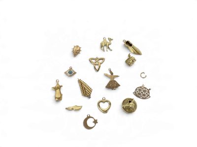 a close up of a bunch of charms on a white surface