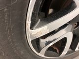 a close up of a car tire with a rusted rim