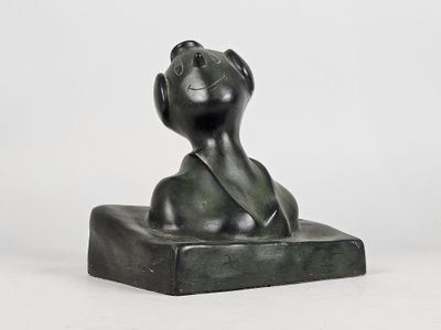 sculpture of a black cat on a stone base