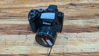 a camera that is sitting on a wooden table