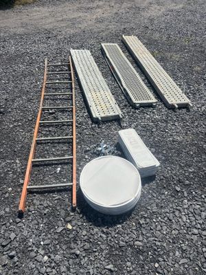 a ladder, a bowl, and a plate on the ground