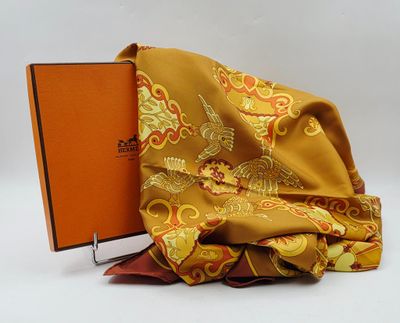 a book sitting on top of a pile of folded fabric