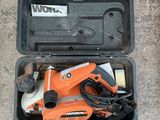 an orange and black box with tools in it sitting on the ground