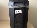 a paper shredder sitting on top of a shelf