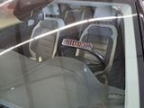 a car that has a remote control in the passenger seat