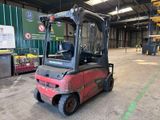 a red forklift truck parked in a warehouse