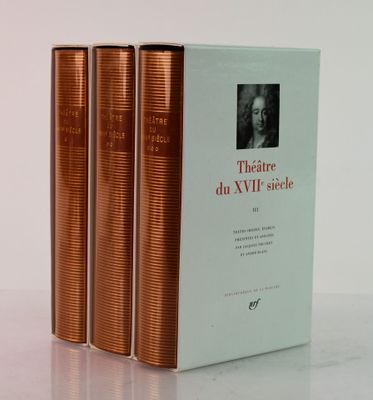 three books sitting on top of a white table next to each other