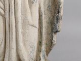an old statue of a woman holding a baby in her arms