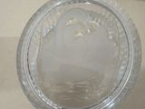 a clear plastic container with a lid on a counter