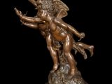 an image of a bronze statue of a man and a woman