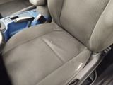a picture of a car seat with a remote control in it