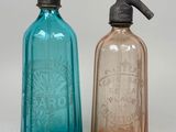 bottles with soap and lotion dispensers on a white surface