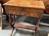 a small wooden table with a drawer underneath it