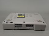 a white laptop with a yellow sticker on the side of it