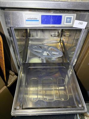 a silver oven with a metal tray inside of it