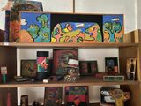 a shelf with many different items on it in a room