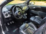 the interior of a car with a steering wheel and a dashboard
