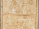 an image of a wooden box with a handle on a gray surface