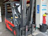 a fork lift truck that is parked in a garage