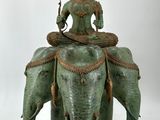 statue of a woman sitting on top of an elephant on a white background