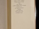 an open book with a poem in it on a table