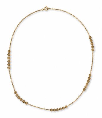 a gold necklace with small beads on a white background