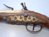 an old gun that is on display on a table