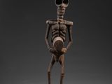 une image représentant une figurine de squelette sur fond noir