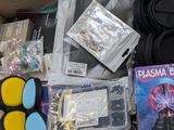 a box full of assorted items that are on the floor