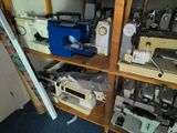 many different types of sewing machines in this room