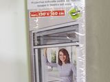 packaging for a window with a picture of a woman looking out of it