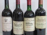 plusieurs bouteilles de vin sont alignées sur une table