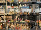 a glass display case with many different figurines in it