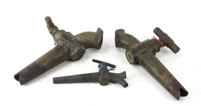 four pieces of old tools are laying on a white surface